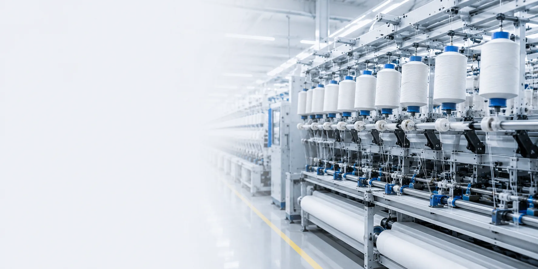 Textile production line showing yarn paths, guide mechanisms, and continuous-duty operation