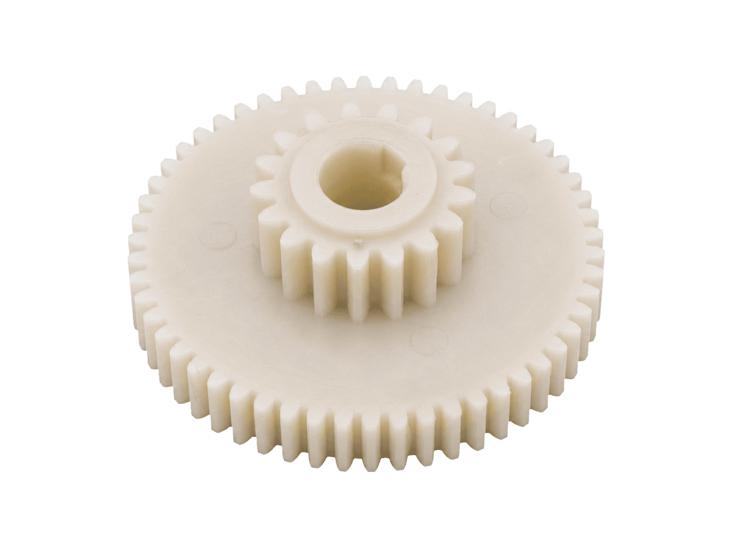 Compound molded spur gear with a smaller pinion integrated above the main gear