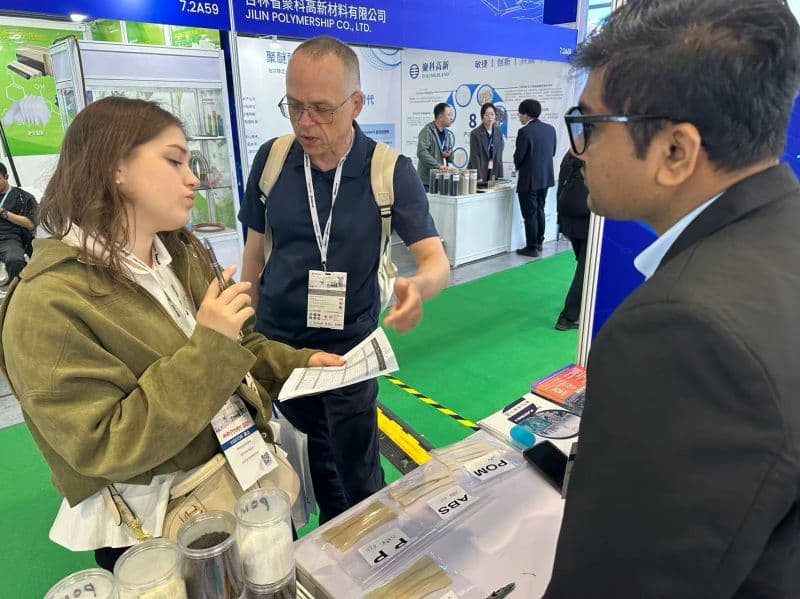 A European gear manufacturer discussing glass-fiber-reinforced POM with Taiyi Polymer at CHINAPLAS 2026
